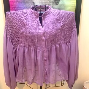 This blouse has never been worn although the tag was removed.